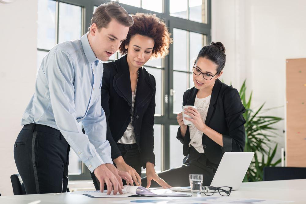 UK business team reviewing a tender or supplier requirements document