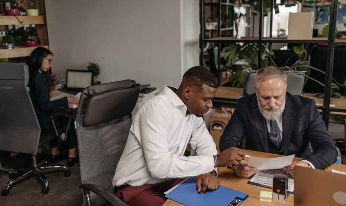 Small business team reviewing quality management processes